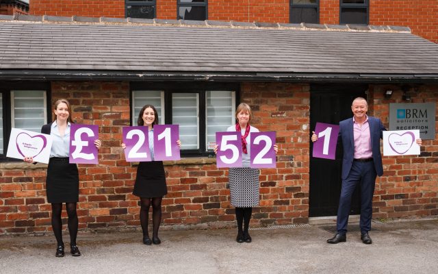 Members of BRM Solicitors Wills and Probate Team holding numbers showing the total raised for the 2020 Ashgate Hospicecare Free Wills Month